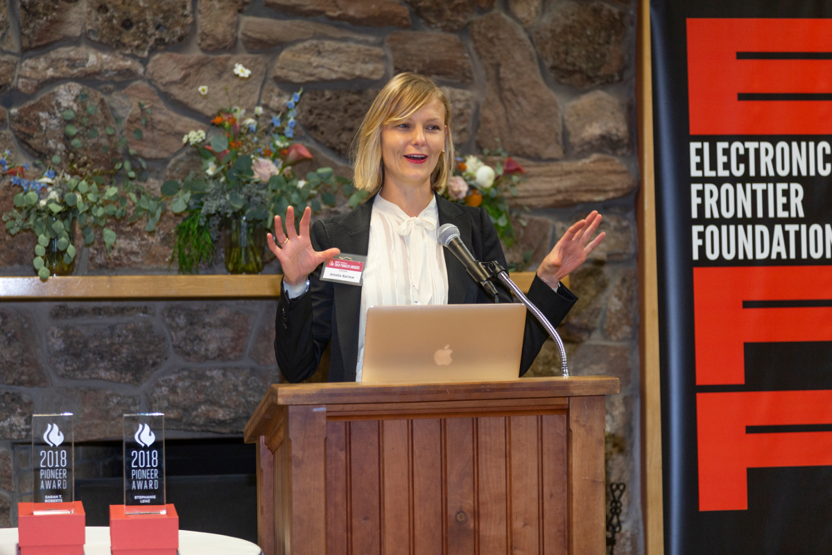 Amelia Barlow addresses the audience during the "Barlow" dedication announcement. Amelia Barlow, daughter of EFF co-founder John Perry Barlow, excitedly recalls her father's legacy.